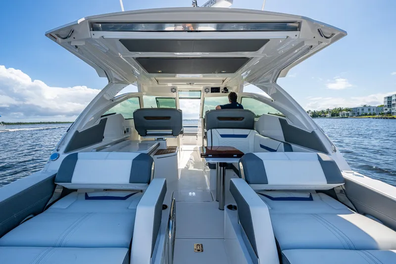 Never Say Never Yacht Photos Pics 2021 Tiara Yachts 34 LX interior with luxurious seating on open water.
