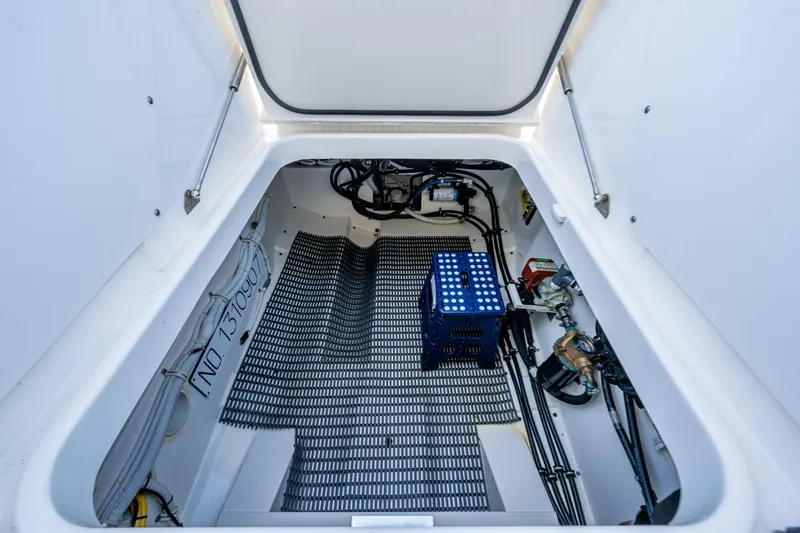 Never Say Never Yacht Photos Pics Engine compartment of 2021 Tiara Yachts 34 LX, showcasing wiring and components.