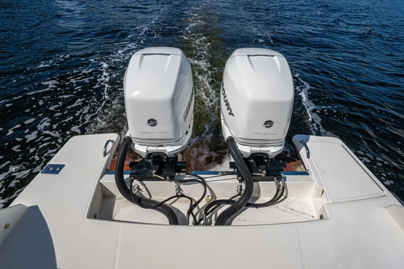 Never Say Never Yacht Photos Pics 2021 Tiara Yachts 34 LX with dual Mercury outboard engines on water.