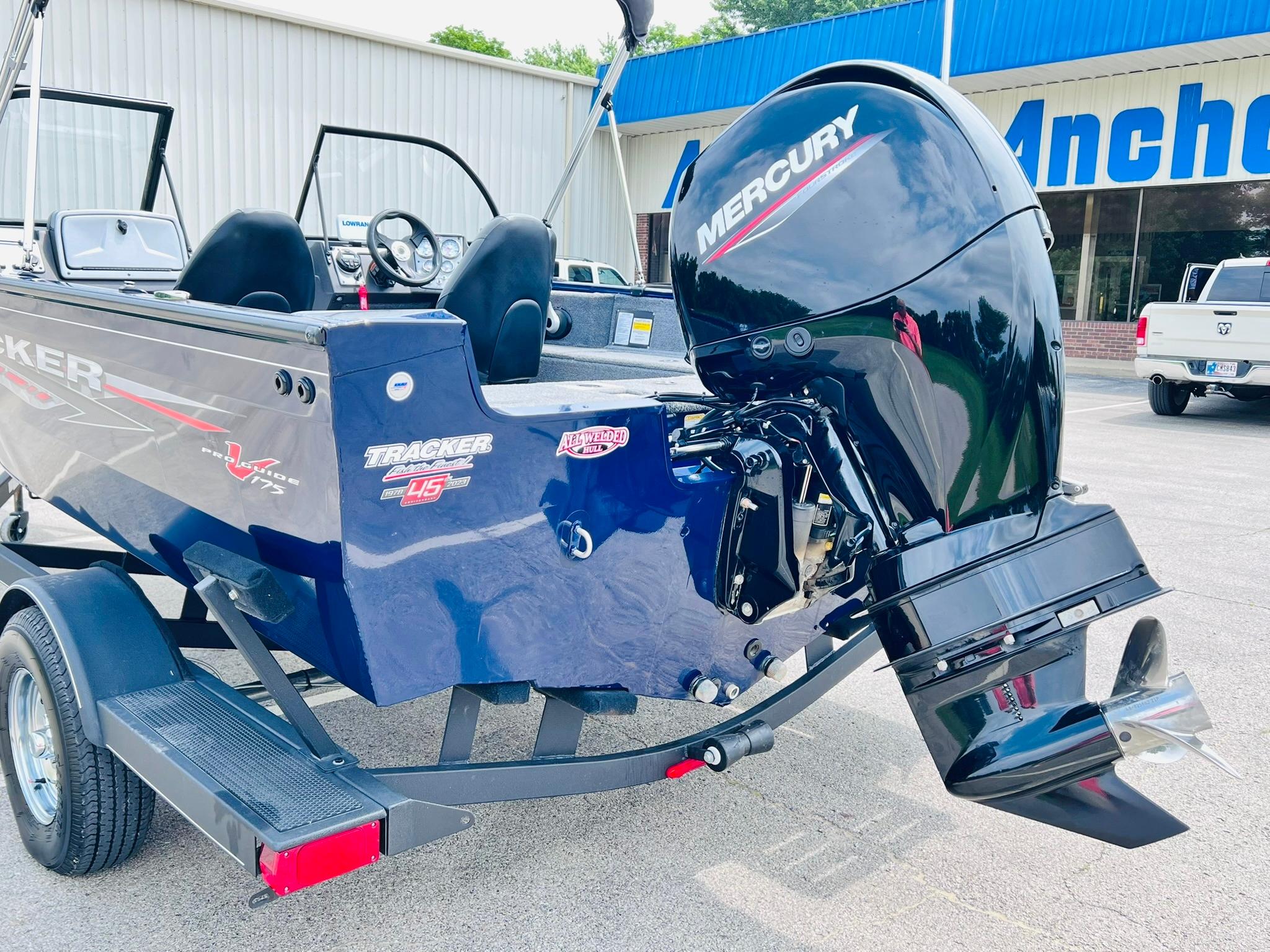 2023 Tracker Pro Guide V-175 WT boat with Mercury outboard motor, parked on a trailer.