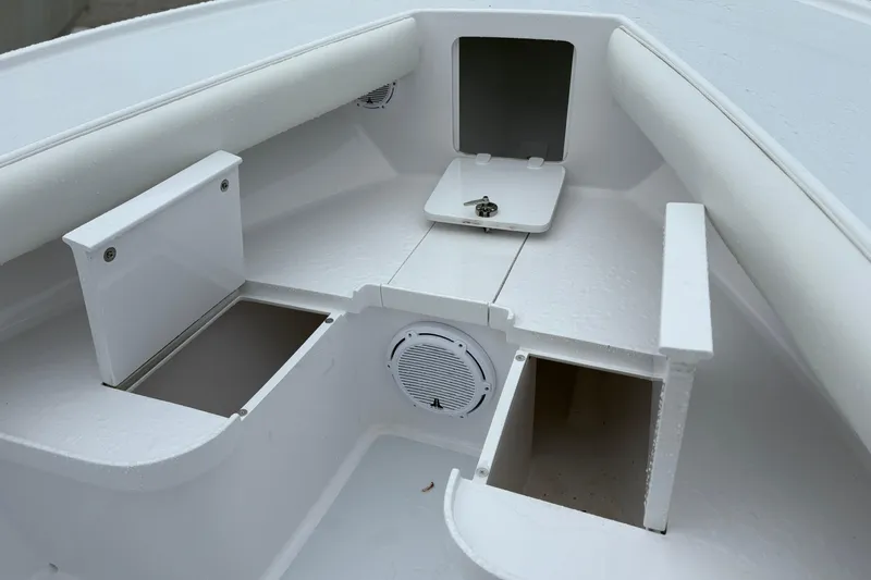  Yacht Photos Pics Interior of a 2025 Weaver 270 boat showing storage compartments and speaker.