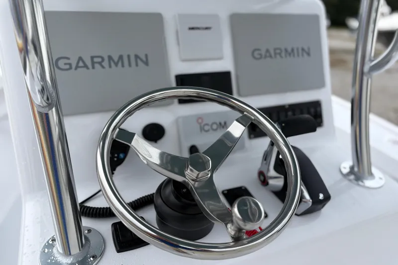  Yacht Photos Pics Steering console of Weaver 270 boat, featuring Garmin displays and Icom controls, 2025 model.