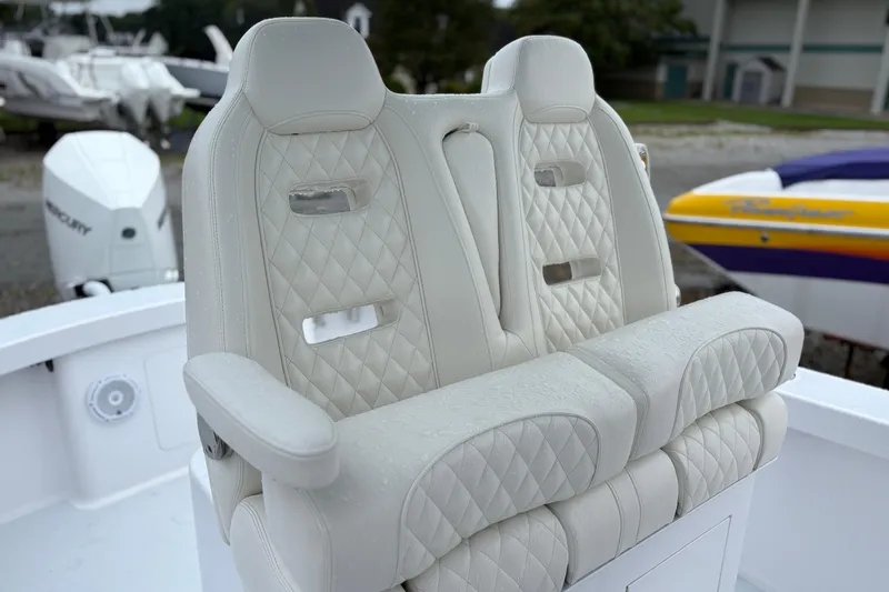  Yacht Photos Pics Luxurious white leather boat seats on a 2025 Weaver 270, featuring diamond stitching.