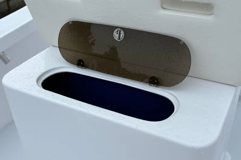  Yacht Photos Pics Boat storage compartment on Weaver 270, 2025 model, with wet surface and open lid.