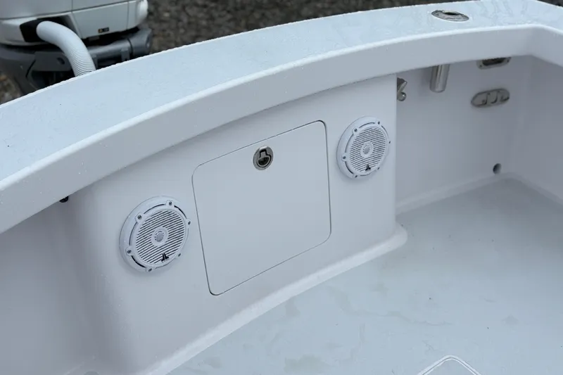  Yacht Photos Pics 2025 Weaver 270 boat interior with speakers and storage compartment.