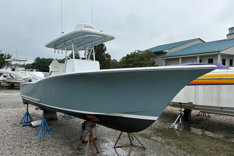 Yacht Photos Pics 2025 Weaver 270 boat on stands, with Garmin equipment, in a boatyard setting.