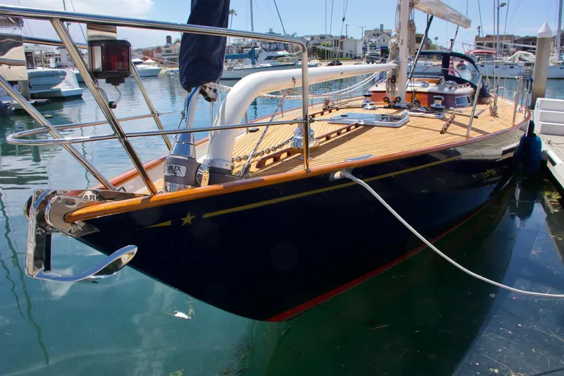 Volunteer Yacht Photos Pics Custom 1996 Bruckmann Yachts docked in marina, featuring sleek design and wooden deck.