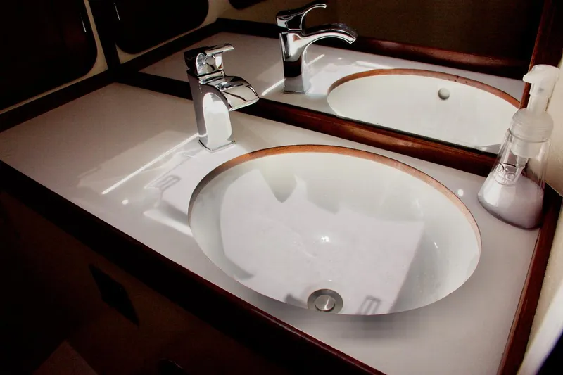 Volunteer Yacht Photos Pics Luxury yacht bathroom sink with modern faucet, Bruckmann Yachts, 1996 model.