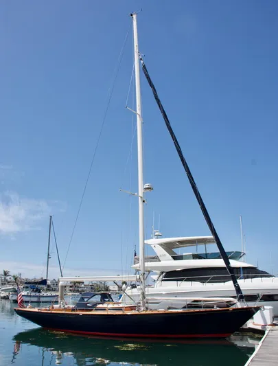 Volunteer Yacht Photos Pics Custom 1996 Bruckmann Yachts sailboat docked under clear blue sky.