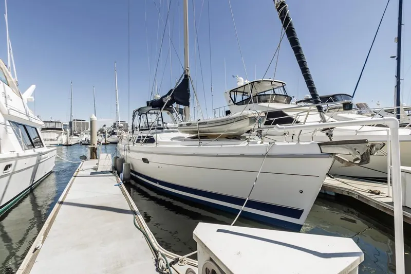 Romanc'n The Zea Yacht Photos Pics Sailboat docked at marina, Hunter 456 model, 1997, clear sky background.