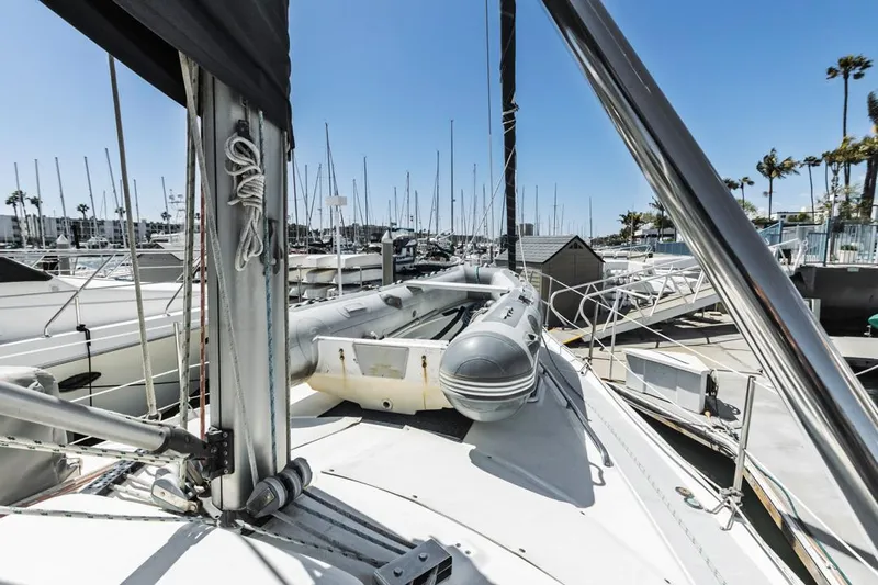 Romanc'n The Zea Yacht Photos Pics Sailboat deck view in marina, Hunter 456, 1997 model, with inflatable dinghy and clear blue sky.