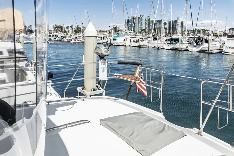Romanc'n The Zea Yacht Photos Pics Hunter 456 yacht docked in marina, 1997 model, with cityscape and sailboats in background.