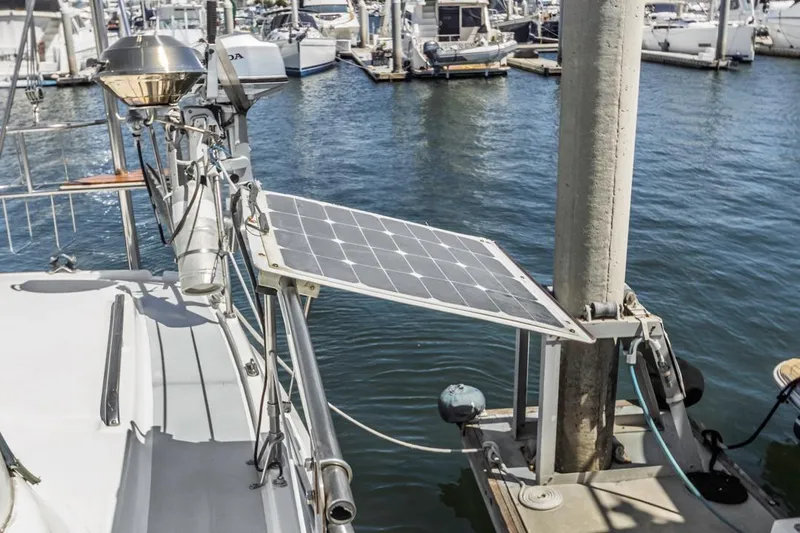 Romanc'n The Zea Yacht Photos Pics Sailboat with solar panel docked at marina, Hunter 456, 1997 model.