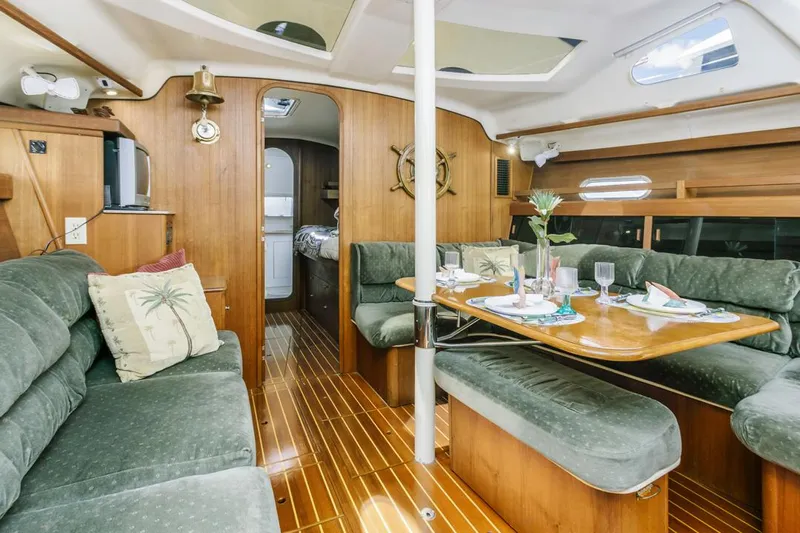 Romanc'n The Zea Yacht Photos Pics Luxurious 1997 Hunter 456 yacht interior with elegant wood finish and plush seating.