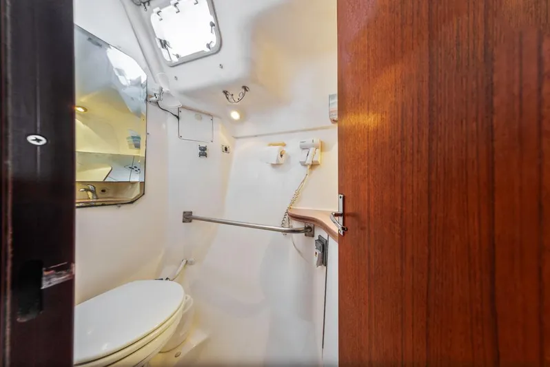Romanc'n The Zea Yacht Photos Pics Compact bathroom interior of 1997 Hunter 456 yacht with toilet and mirror.