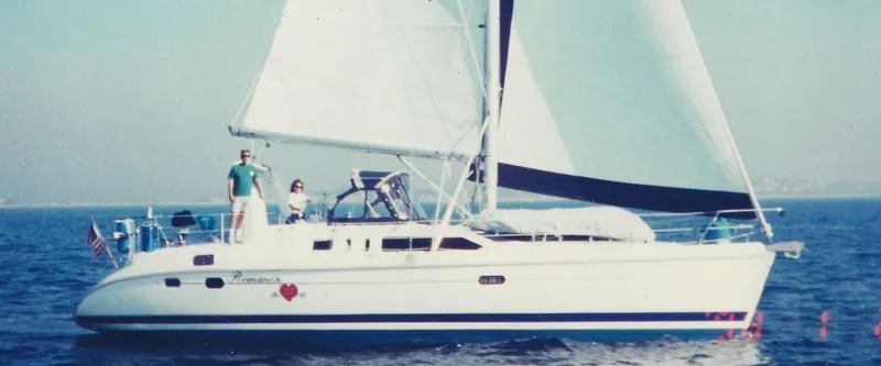 Romanc'n The Zea Yacht Photos Pics Sailing yacht Hunter 456, 1997 model, cruising on open water with two people on deck.