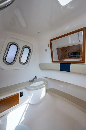  Yacht Photos Pics 2015 Belzona 32C boat interior with porthole windows and mirror