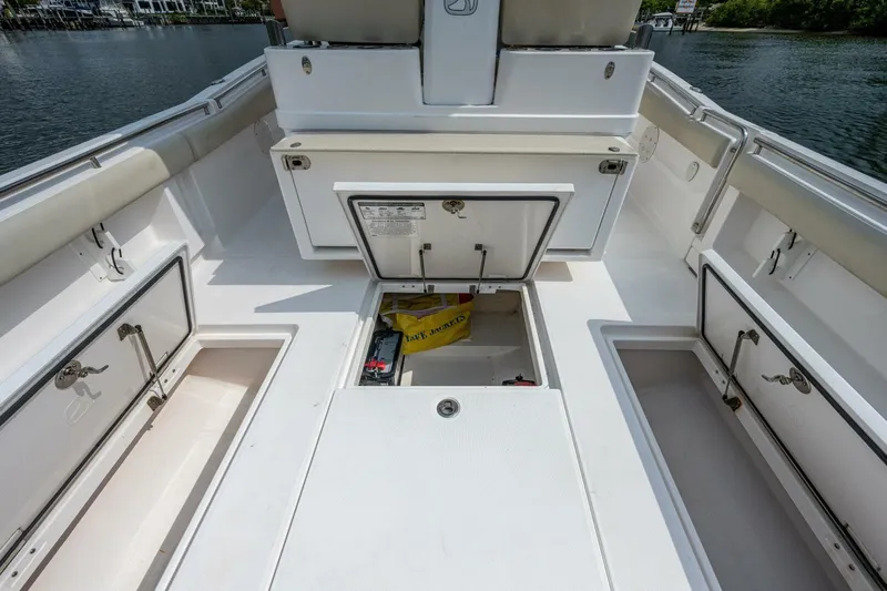  Yacht Photos Pics 2015 Belzona 32C boat deck with storage compartments and seating.