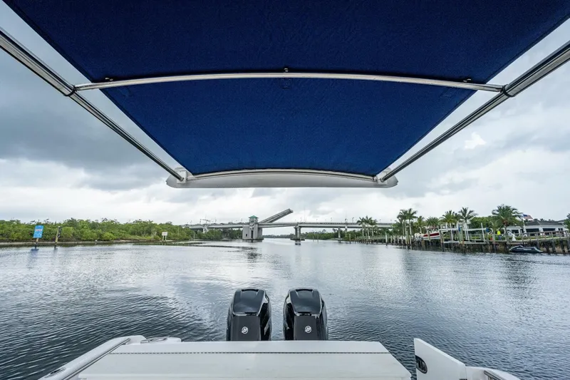  Yacht Photos Pics View from a 2015 Belzona 32C boat with dual engines under a blue canopy.