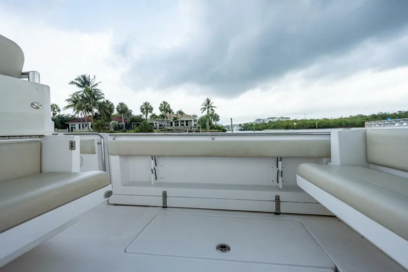  Yacht Photos Pics 2015 Belzona 32C boat interior with cushioned seating and scenic waterfront view.