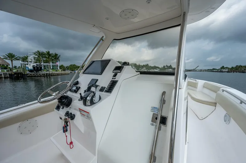  Yacht Photos Pics 2015 Belzona 32C boat helm station with modern controls and waterfront view.