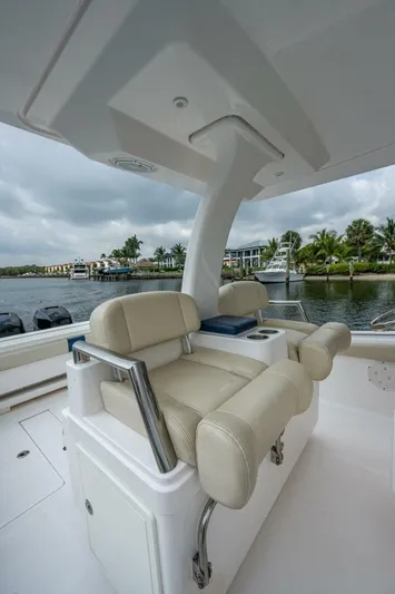  Yacht Photos Pics 2015 Belzona 32C boat with beige seating and waterfront view.