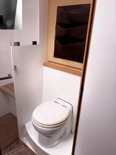 Sea Serenity Yacht Photos Pics Modern bathroom in 2012 Lagoon 560 yacht with sleek design and compact toilet.