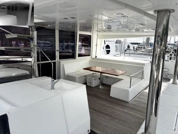 Sea Serenity Yacht Photos Pics Spacious deck of 2012 Lagoon 560 yacht with seating and table.
