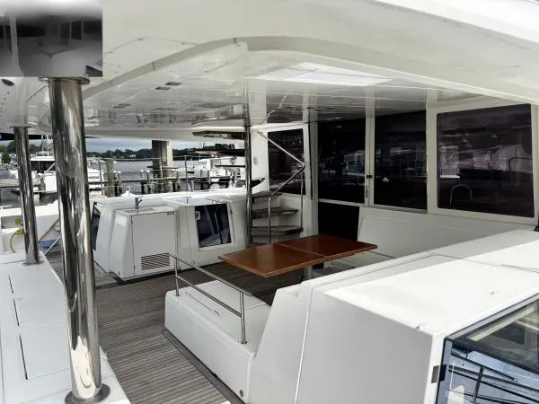 Sea Serenity Yacht Photos Pics Spacious deck of 2012 Lagoon 560 catamaran with seating and table.