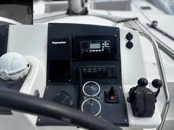 Sea Serenity Yacht Photos Pics Control panel of a 2012 Lagoon 560 yacht with Raymarine equipment and navigation controls.