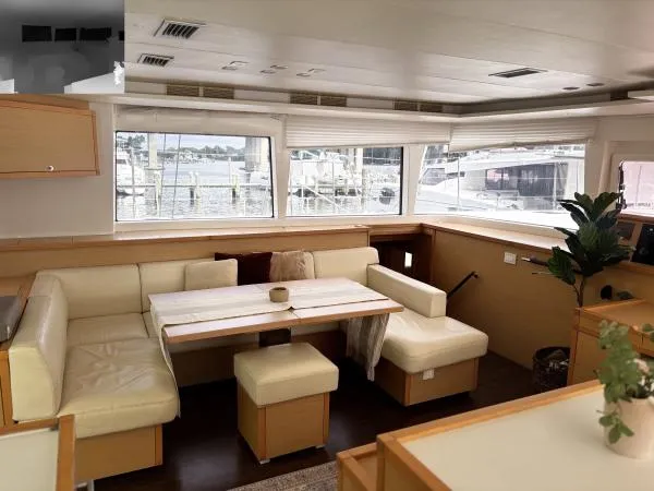 Sea Serenity Yacht Photos Pics Interior of 2012 Lagoon 560 yacht with beige seating and large windows.