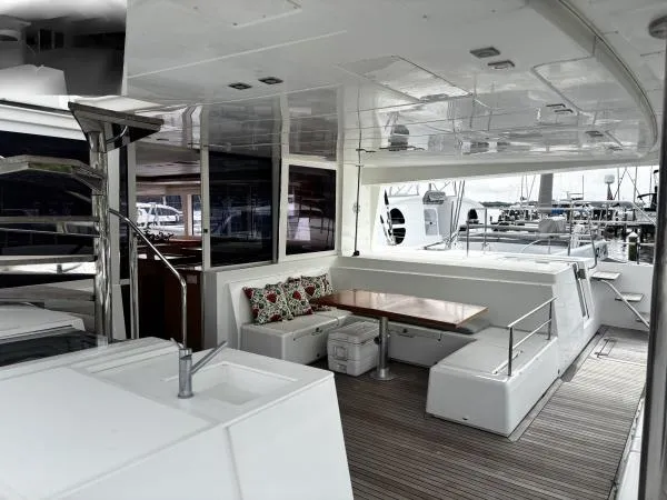 Sea Serenity Yacht Photos Pics Spacious deck of 2012 Lagoon 560 yacht with seating and dining area.