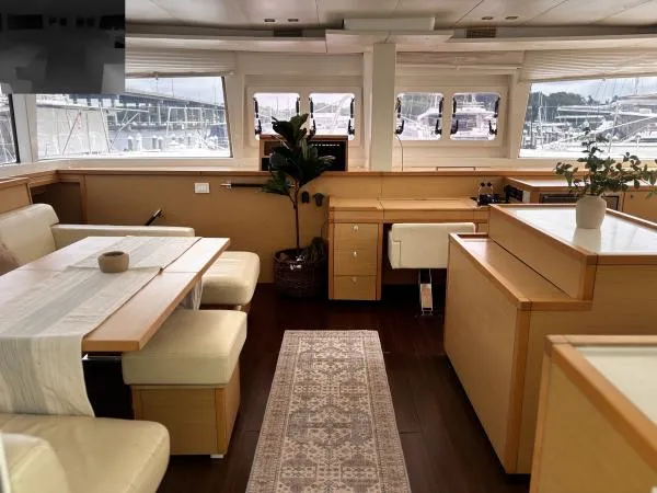 Sea Serenity Yacht Photos Pics Luxurious interior of 2012 Lagoon 560 yacht with elegant seating and modern decor.