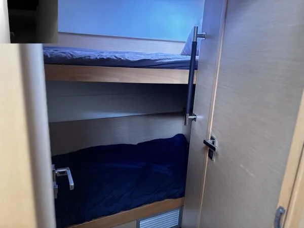 Sea Serenity Yacht Photos Pics Bunk beds inside a 2012 Lagoon 560 yacht cabin.