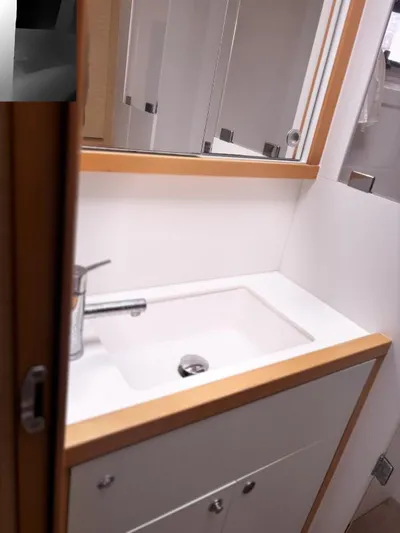 Sea Serenity Yacht Photos Pics Bathroom sink area in a 2012 Lagoon 560 yacht, featuring modern fixtures.
