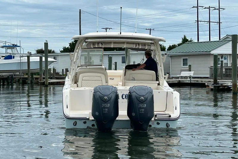  Yacht Photos Pics 2023 Grady-White Freedom 307 boat with dual Yamaha 300 engines in a marina.