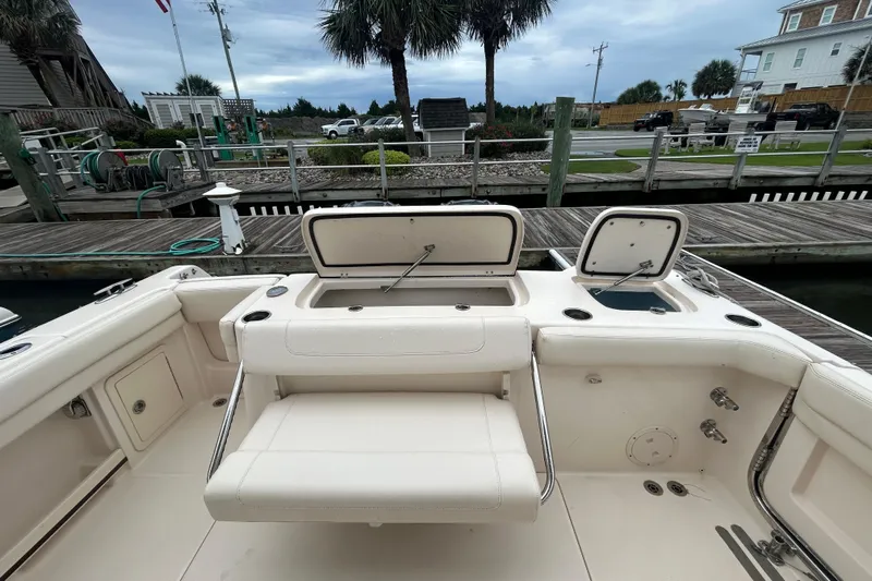  Yacht Photos Pics 2023 Grady-White Freedom 307 boat interior with open storage compartments at dock.