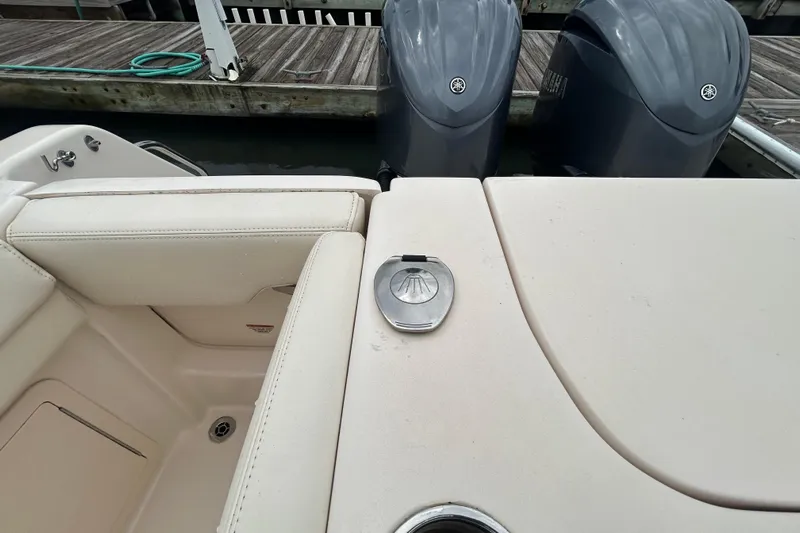  Yacht Photos Pics 2023 Grady-White Freedom 307 boat interior with dual engines at dock.