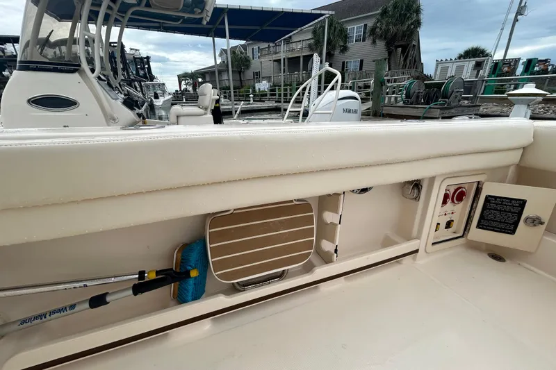  Yacht Photos Pics 2023 Grady-White Freedom 307 boat interior with storage and control panel.