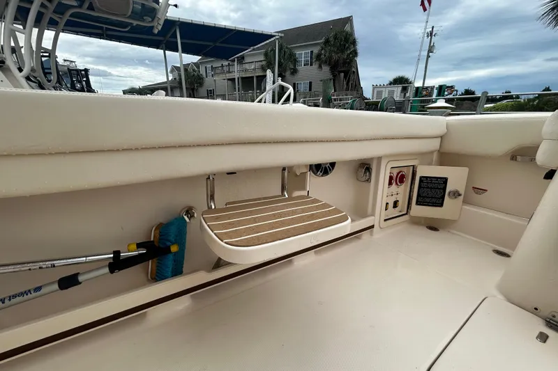  Yacht Photos Pics 2023 Grady-White Freedom 307 boat interior with storage and seating area.