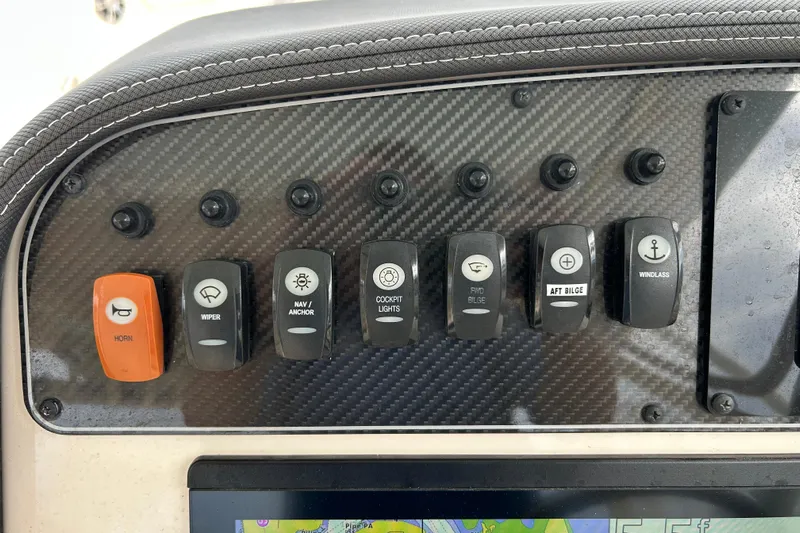  Yacht Photos Pics Control panel of 2023 Grady-White Freedom 307 boat with various switches.