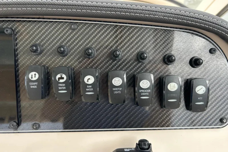  Yacht Photos Pics Control panel of 2023 Grady-White Freedom 307 boat with various switches.