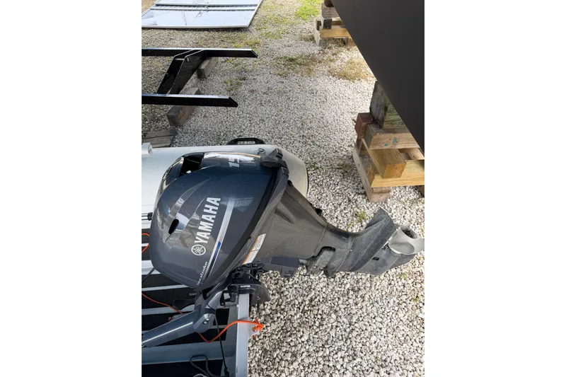 Aurora Yacht Photos Pics Yamaha outboard motor on C-Catamarans 48, 2025 model, resting on gravel.