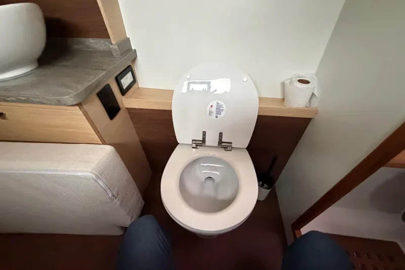 Aurora Yacht Photos Pics Modern bathroom interior on 2025 C-Catamarans 48 yacht, featuring toilet and sink.
