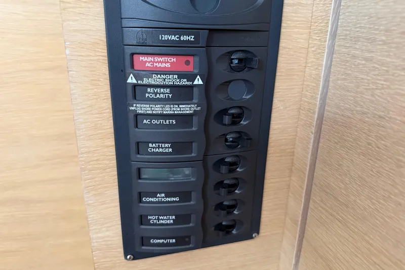 Aurora Yacht Photos Pics Electrical panel on 2025 C-Catamarans 48, featuring switches for AC mains and appliances.