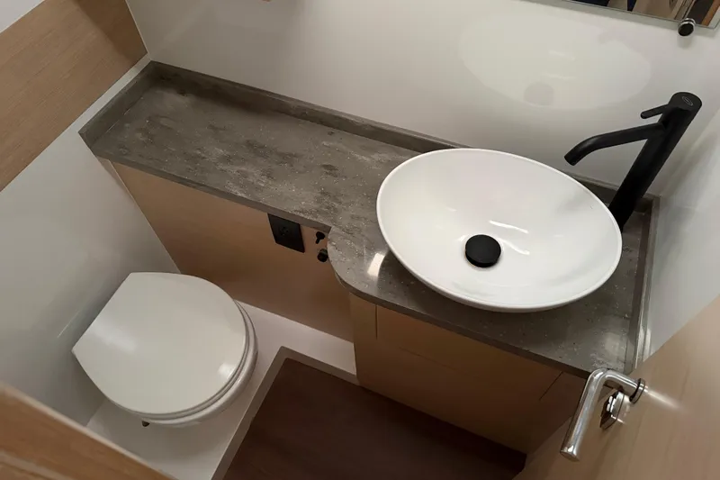 Aurora Yacht Photos Pics Modern bathroom in 2025 C-Catamarans 48, featuring sleek sink and toilet design.