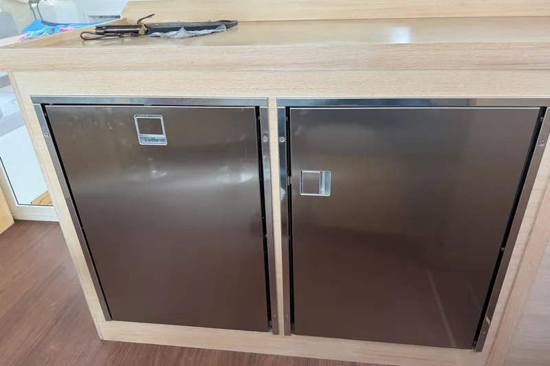 Aurora Yacht Photos Pics Stainless steel fridge doors on 2025 C-Catamarans 48 yacht interior.