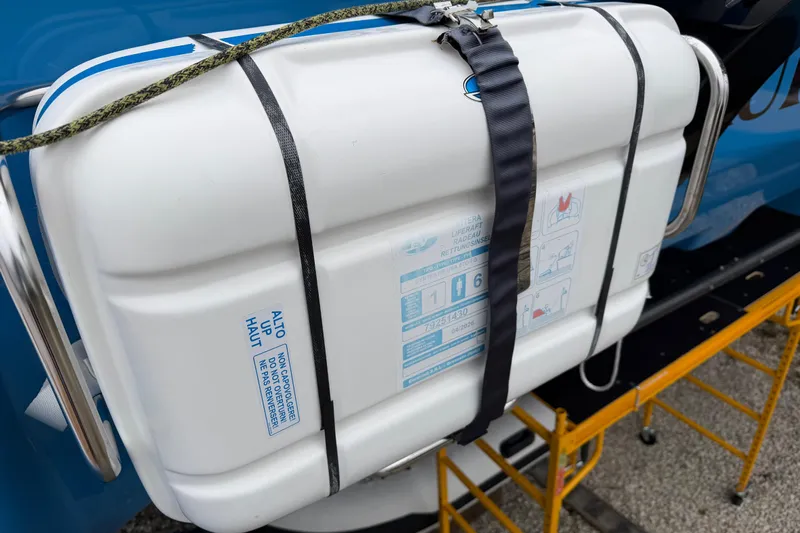 Aurora Yacht Photos Pics Life raft on 2025 C-Catamarans 48, secured with straps, ready for emergency use.
