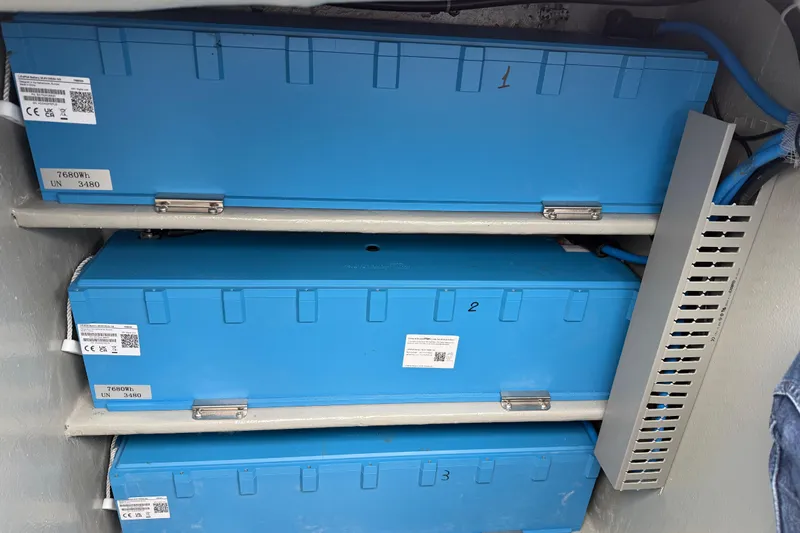 Aurora Yacht Photos Pics Blue battery units in a 2025 C-Catamarans 48, labeled with energy capacity.