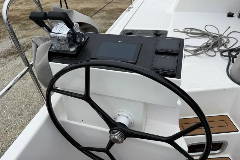 Aurora Yacht Photos Pics Steering wheel and controls of 2025 C-Catamarans 48, featuring modern navigation equipment.